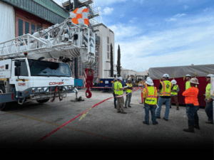 Coker team standing in front of a truck