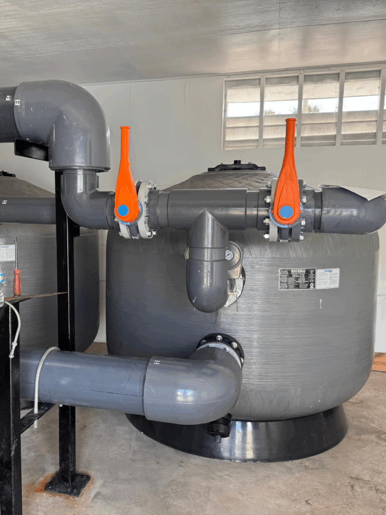 Newly installed commercial pool filters and piping.